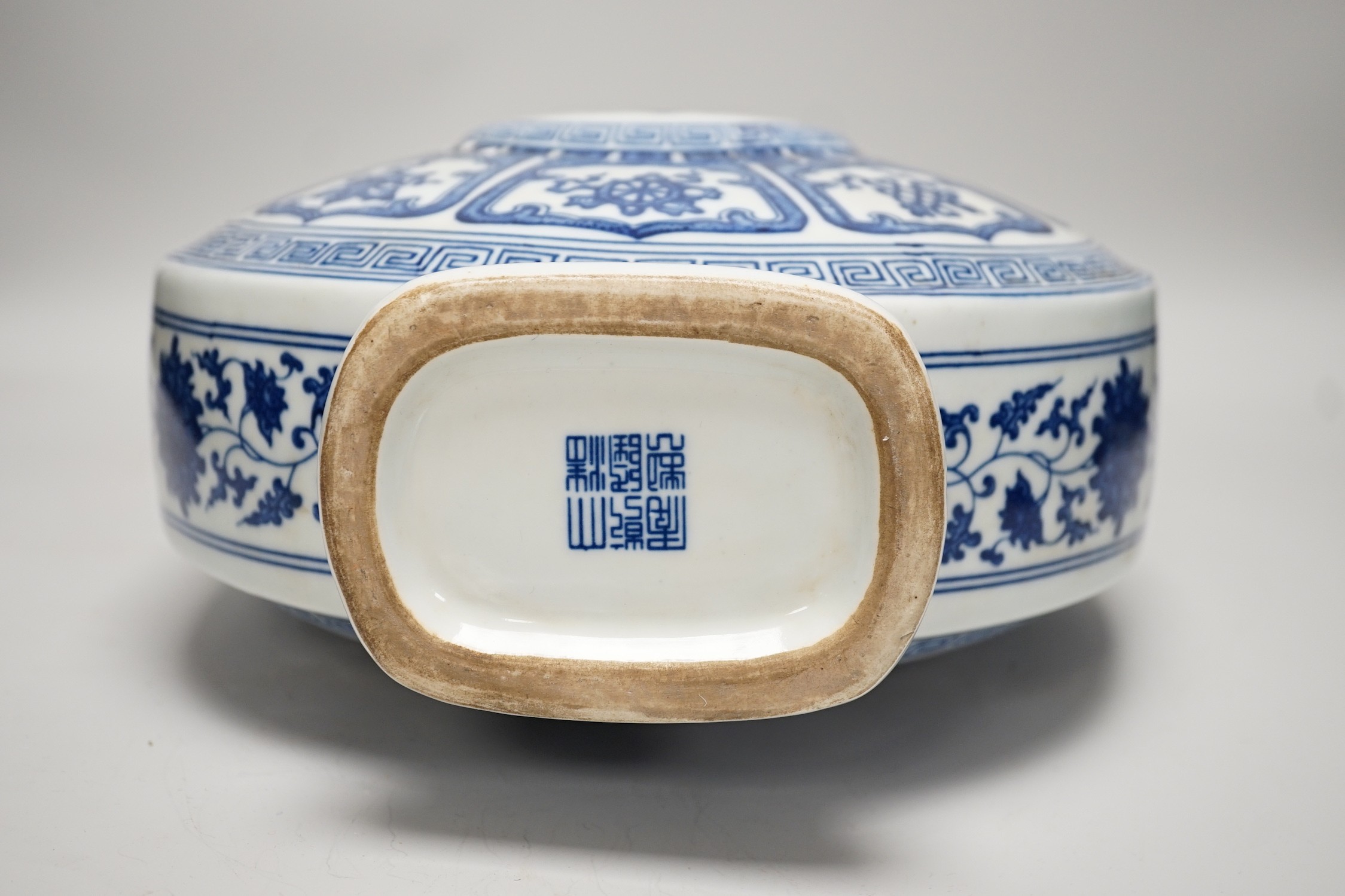 A Chinese blue and white two handled moonflask, together with another Chinese vase and Chinese figure group, tallest 36cm